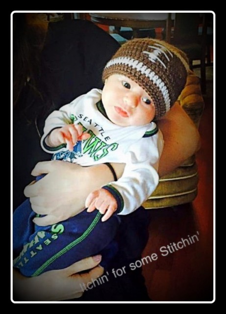 Newborn football beanie crocheted by itchinforsomestitchin.com
