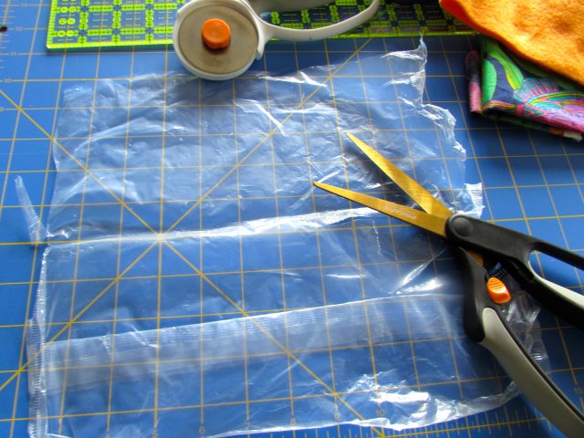 Cutting the plastic for DIY taggie toy. http://www.itchinforsomestitchin.com