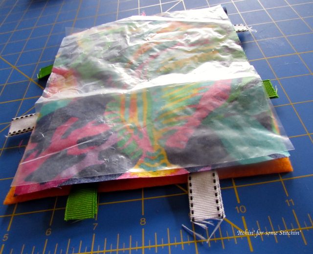 Layering the taggie toy. http://www.itchinforsomestitchin.com