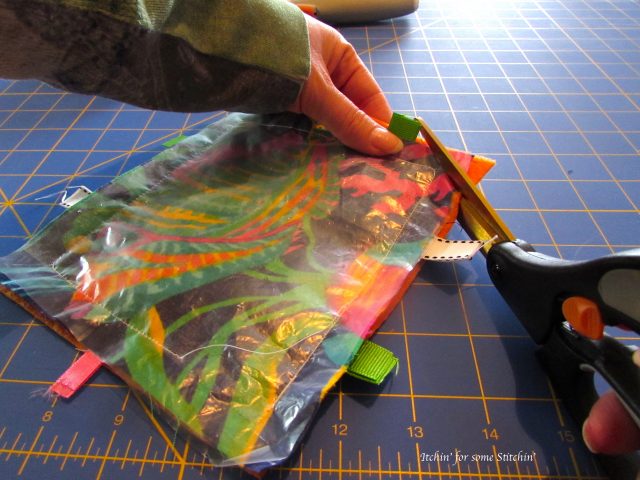 Trimming the edges of taggie toy. http://www.itchinforsomestitchin.com