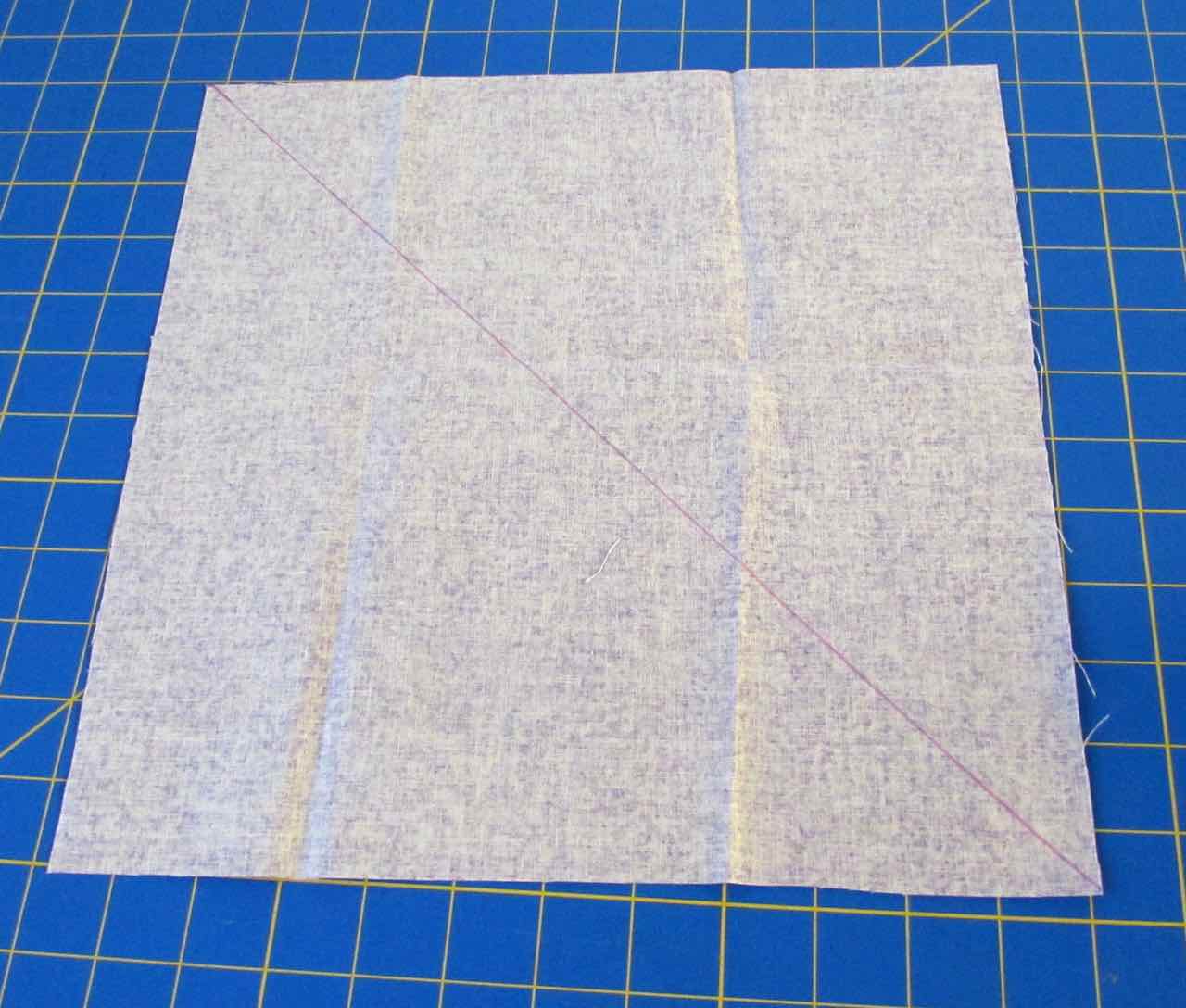 Diagonal line drawn for bias tape by www.itchinforsomestitchin.com