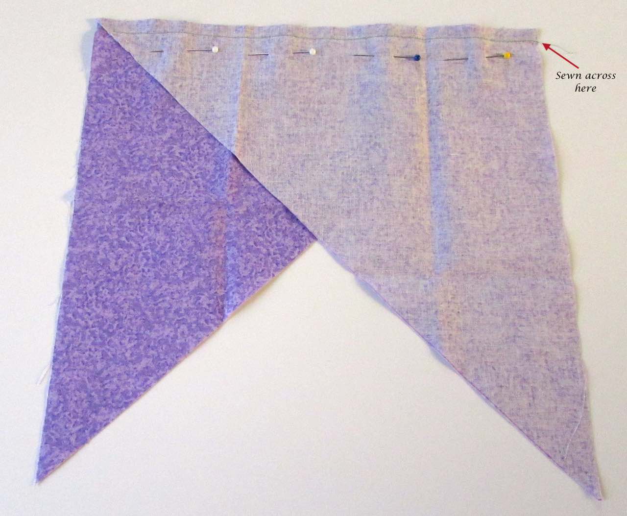 Triangles pinned and sewn together for continuous bias binding tape by www.itchinforsomestitchin.com