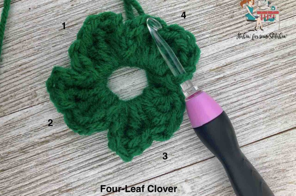 Crochet four-leaf cover appliqué in progress by www.itchinforsomestitchin.com